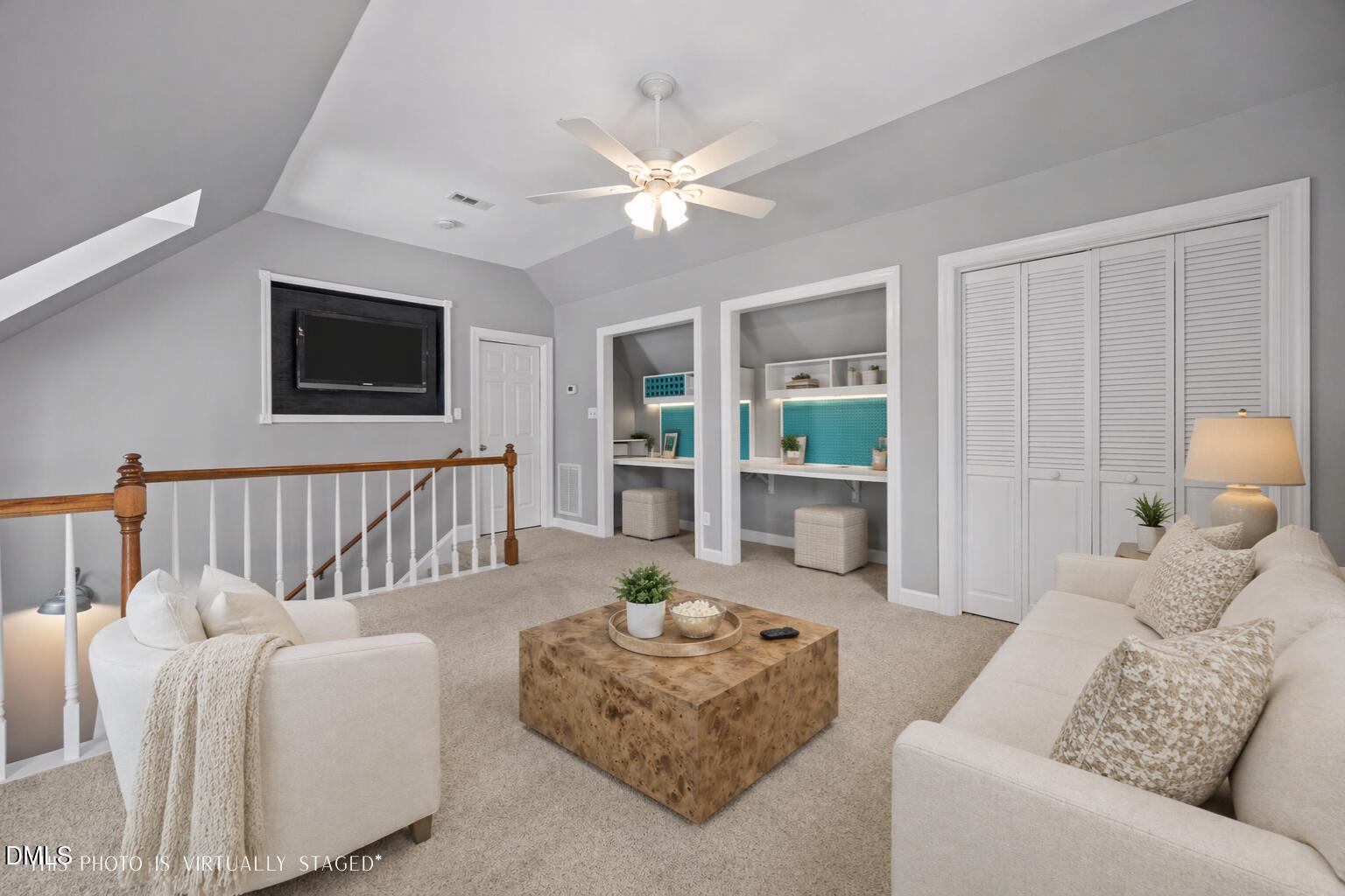 8221 Harps Mill Road Raleigh, NC 27615 - Photo 35 of 46 a living room with furniture and a flat screen tv