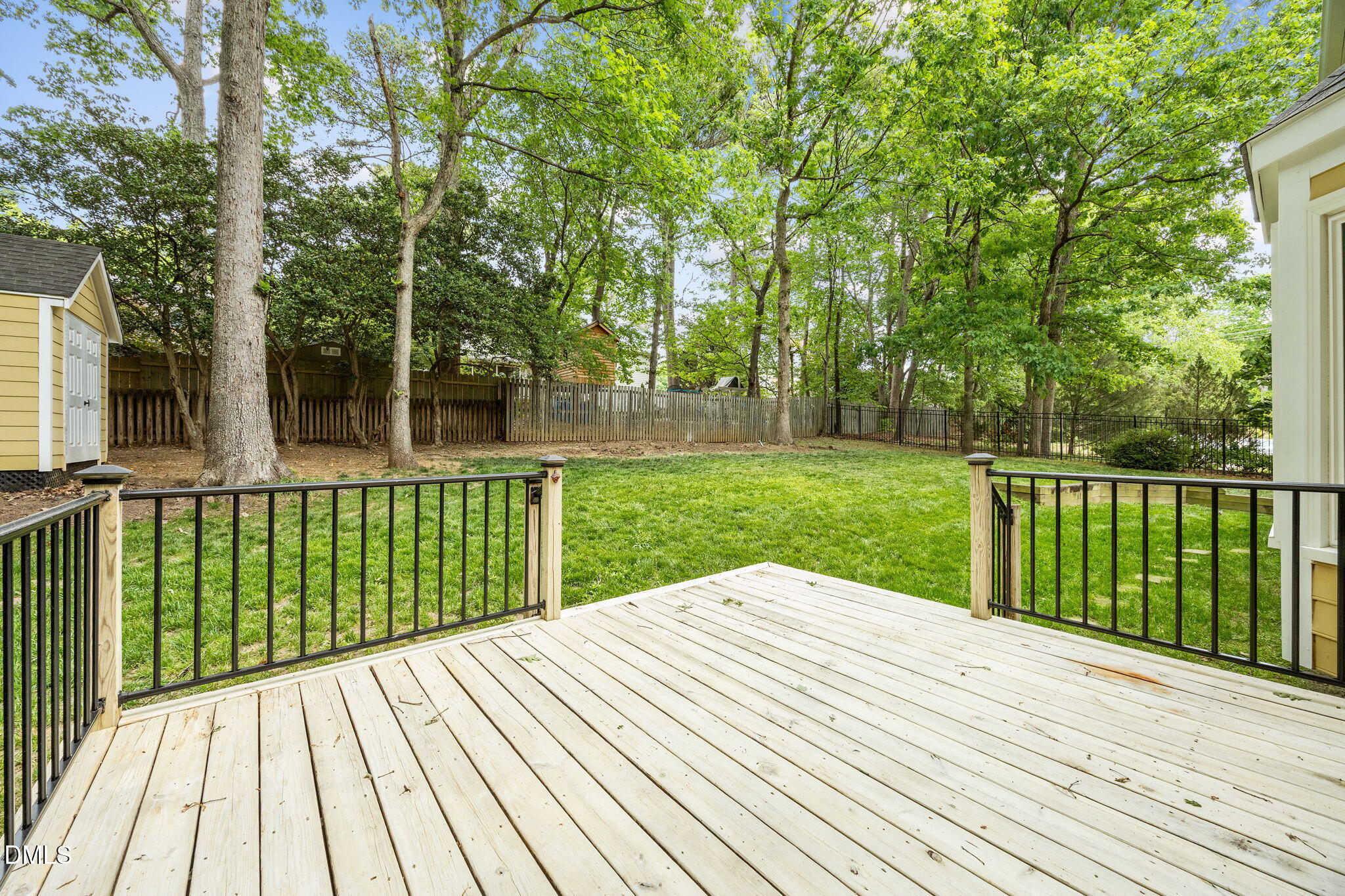 8221 Harps Mill Road Raleigh, NC 27615 - Photo 39 of 46 a view of backyard with a small deck