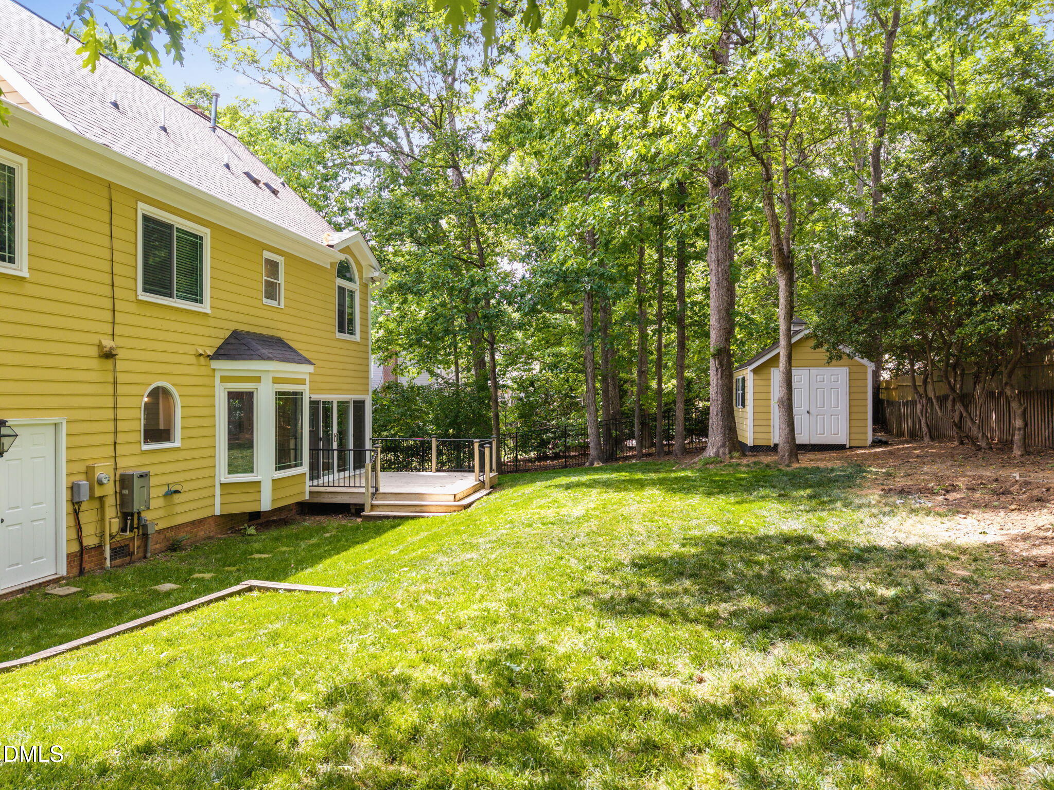 8221 Harps Mill Road Raleigh, NC 27615 - Photo 40 of 46 a view of a house with a yard and sitting area