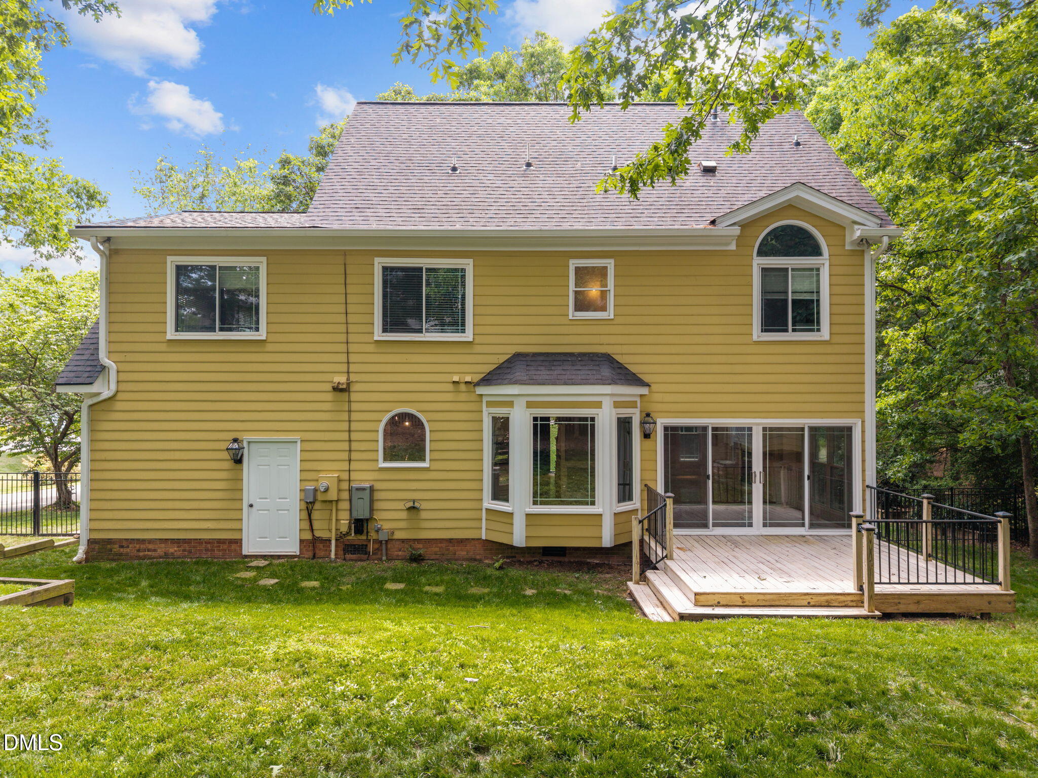 8221 Harps Mill Road Raleigh, NC 27615 - Photo 41 of 46 a front view of a house with a yard