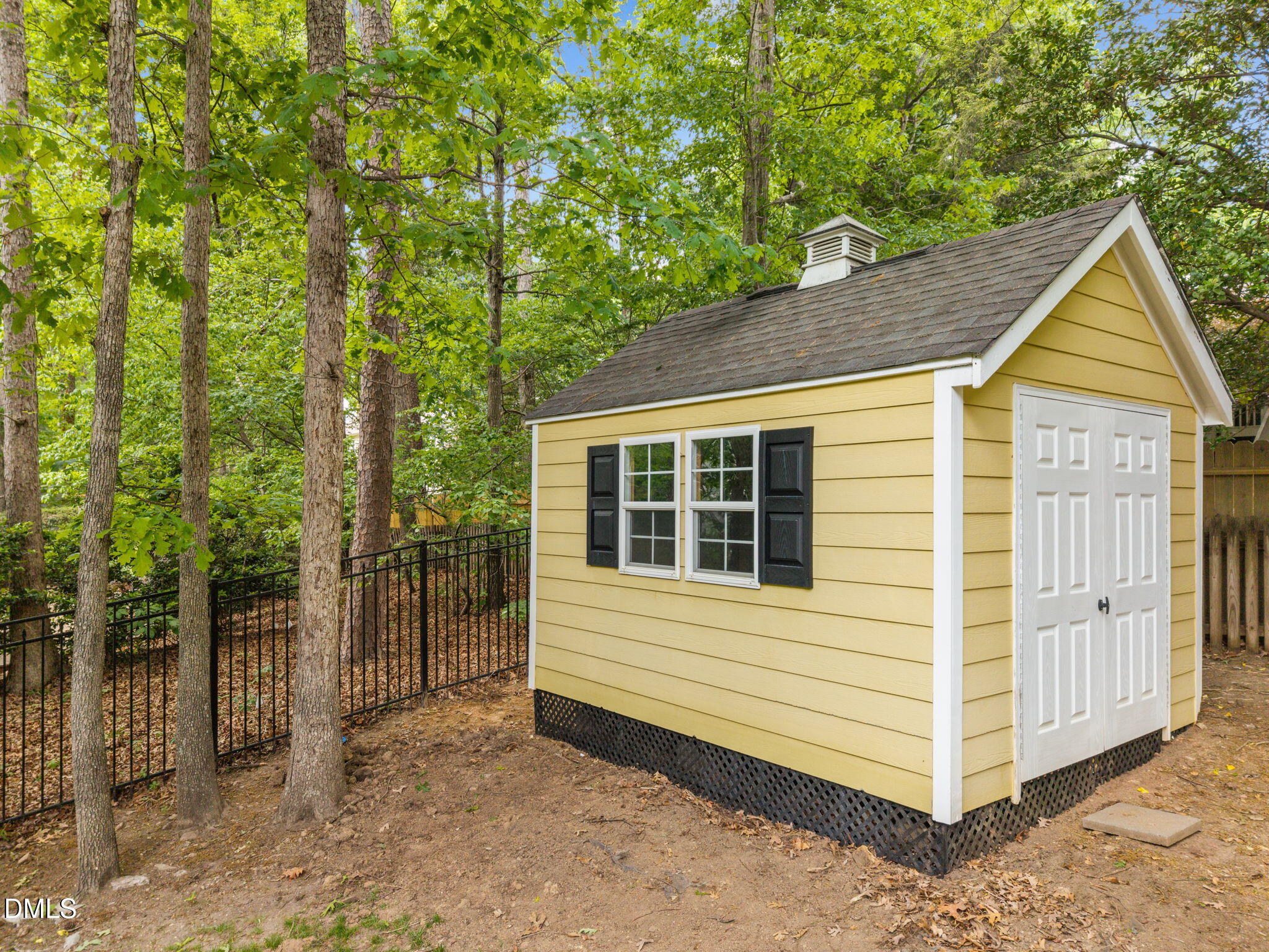 8221 Harps Mill Road Raleigh, NC 27615 - Photo 42 of 46 a view of a house with a yard