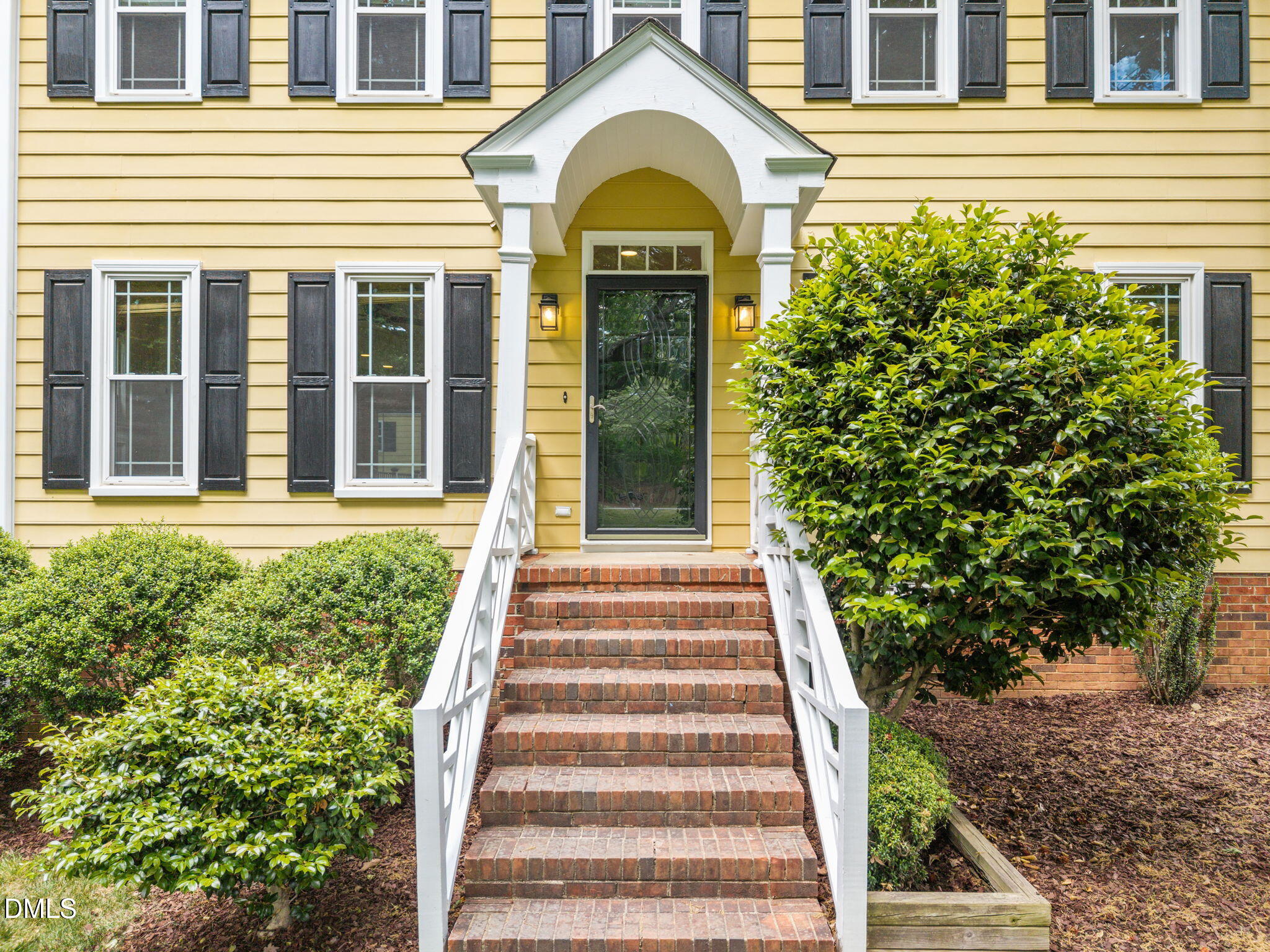 8221 Harps Mill Road Raleigh, NC 27615 - Photo 45 of 46 a view of a house with potted plants