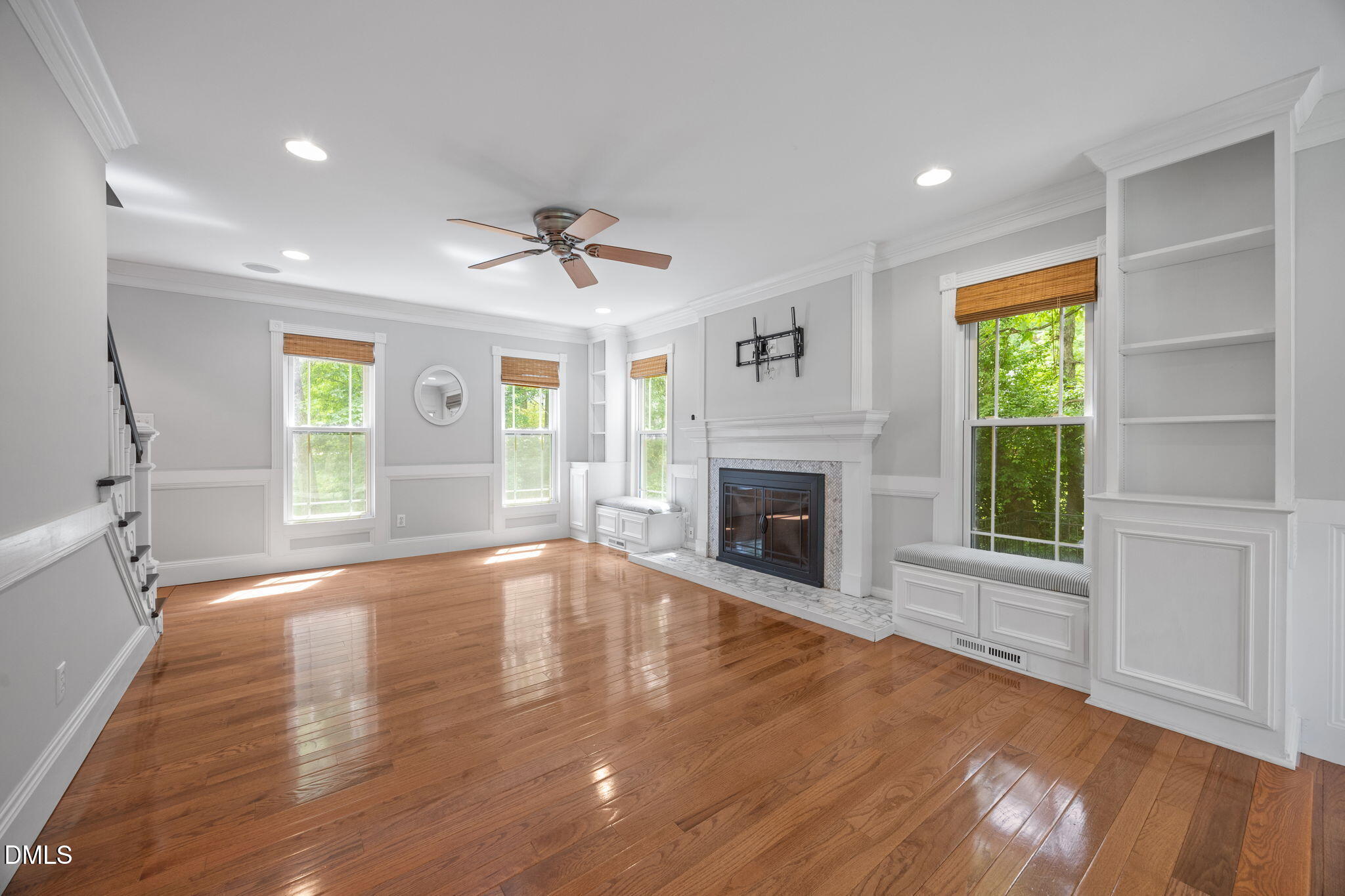8221 Harps Mill Road Raleigh, NC 27615 - Photo 7 of 46 a view of an empty room with a window and fireplace