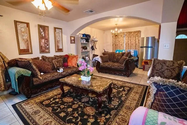 a living room with furniture and a rug