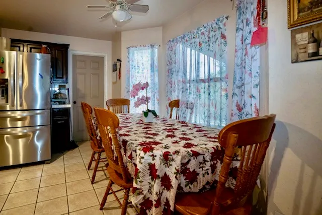 a dining room with furniture and window