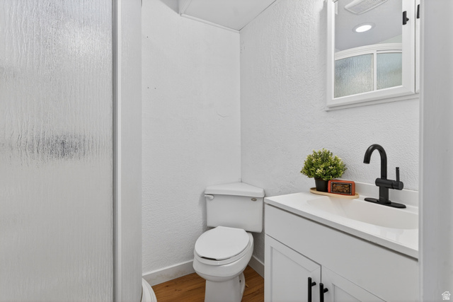 489 Owens Street Layton, UT 84041 - Photo 16 of 25 Full bathroom with vanity, a stall shower, a textured wall, and wood finished floors