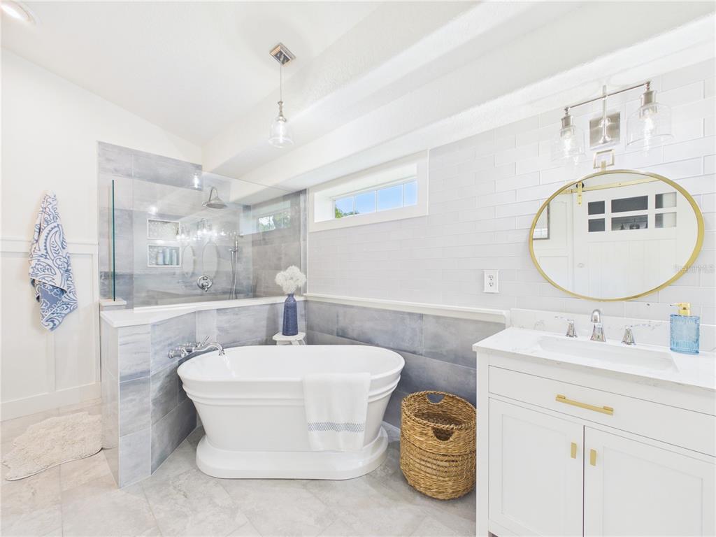 426 Long Cove Road Ormond Beach, FL 32174 - Photo 23 of 73 a bathroom with a double vanity sink mirror and