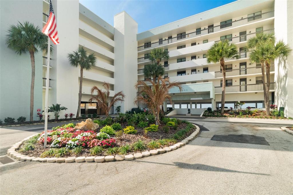14900 Gulf Boulevard, Unit 202 Madeira Beach, FL 33708 - Photo 1 of 37 a view of a fountain in front of a building