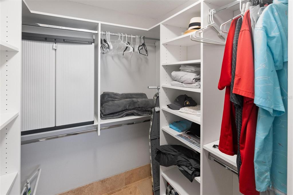 14900 Gulf Boulevard, Unit 202 Madeira Beach, FL 33708 - Photo 19 of 37 a view of walk in closet with clothes and shoes