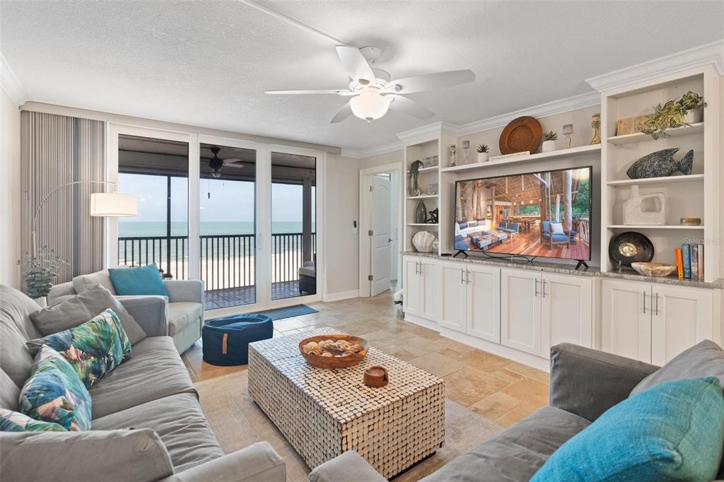 14900 Gulf Boulevard, Unit 202 Madeira Beach, FL 33708 - Photo 2 of 37 a living room with furniture and a window
