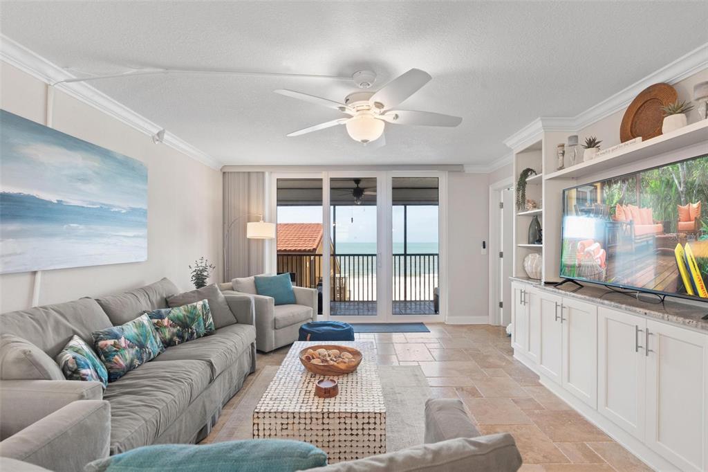 14900 Gulf Boulevard, Unit 202 Madeira Beach, FL 33708 - Photo 3 of 37 a living room with furniture and a large window