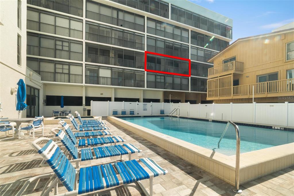 14900 Gulf Boulevard, Unit 202 Madeira Beach, FL 33708 - Photo 37 of 37 a view of a swimming pool with a patio