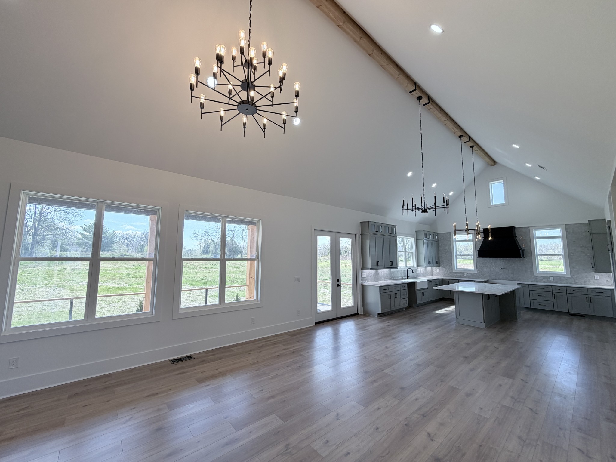 6447 Hopewell Road Springfield, TN 37172 - Photo 12 of 61 a living room with kitchen island furniture and a chandelier