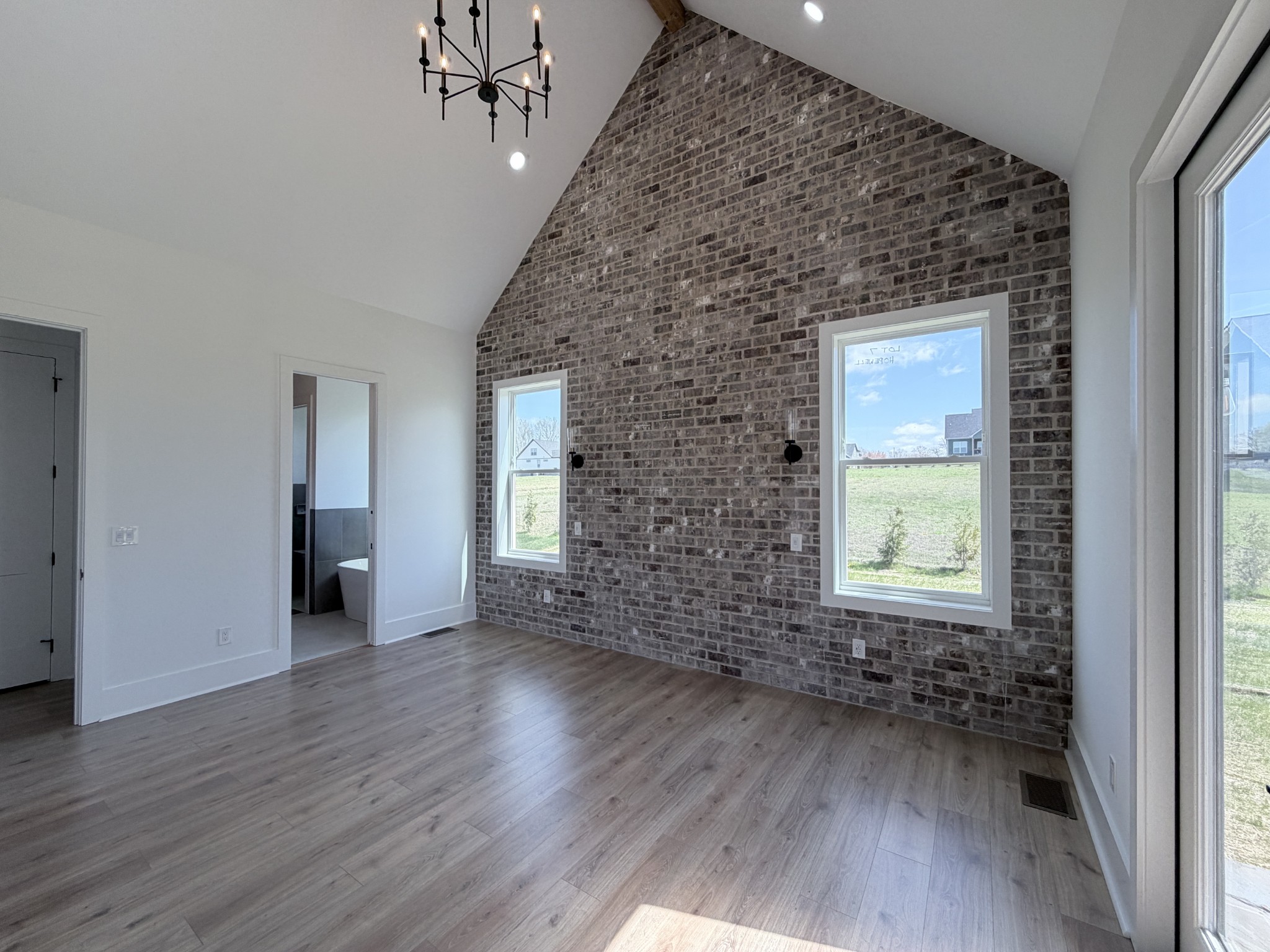 6447 Hopewell Road Springfield, TN 37172 - Photo 19 of 61 an empty room with wooden floor and a window