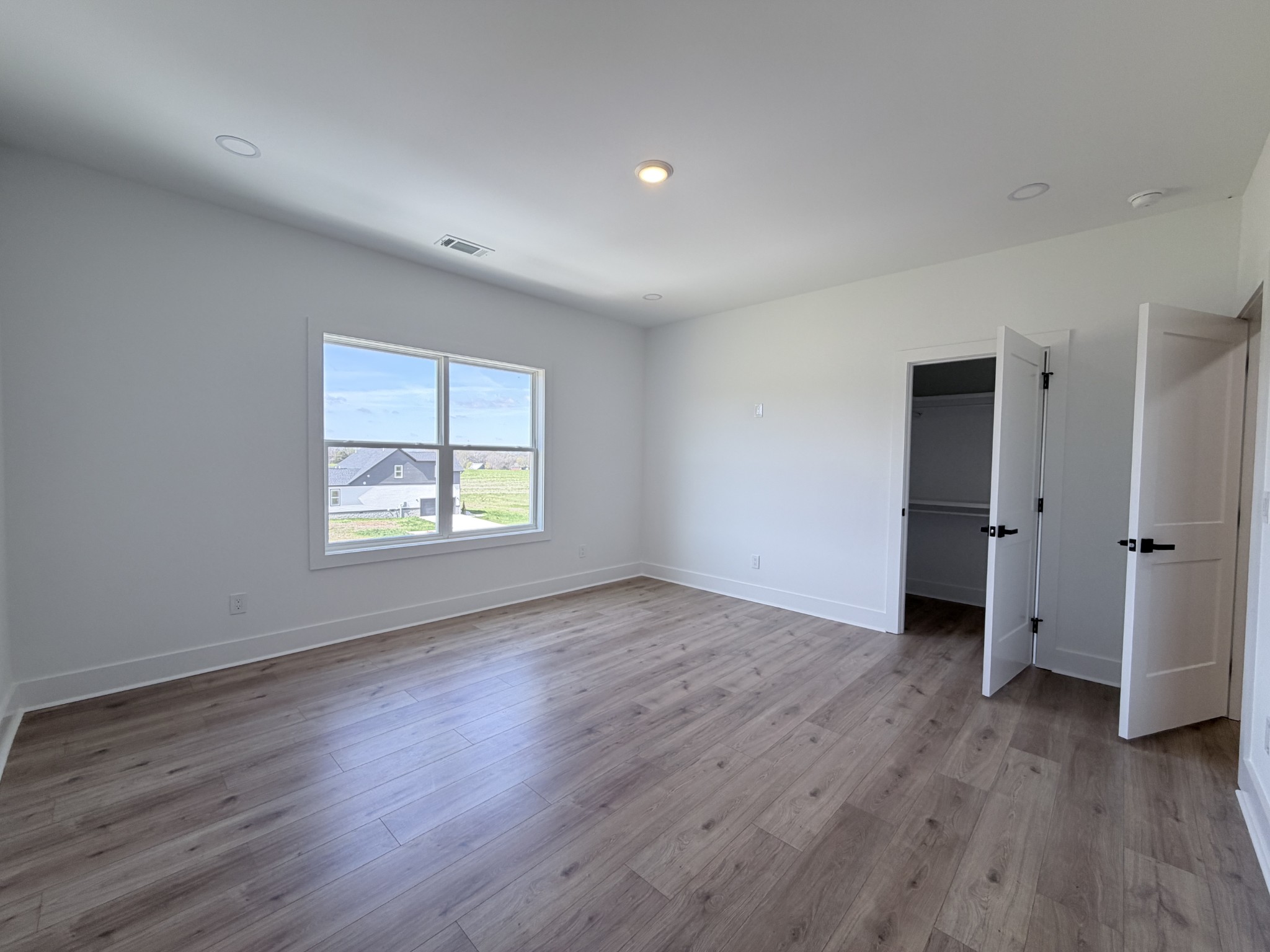 6447 Hopewell Road Springfield, TN 37172 - Photo 21 of 61 an empty room with wooden floor and window
