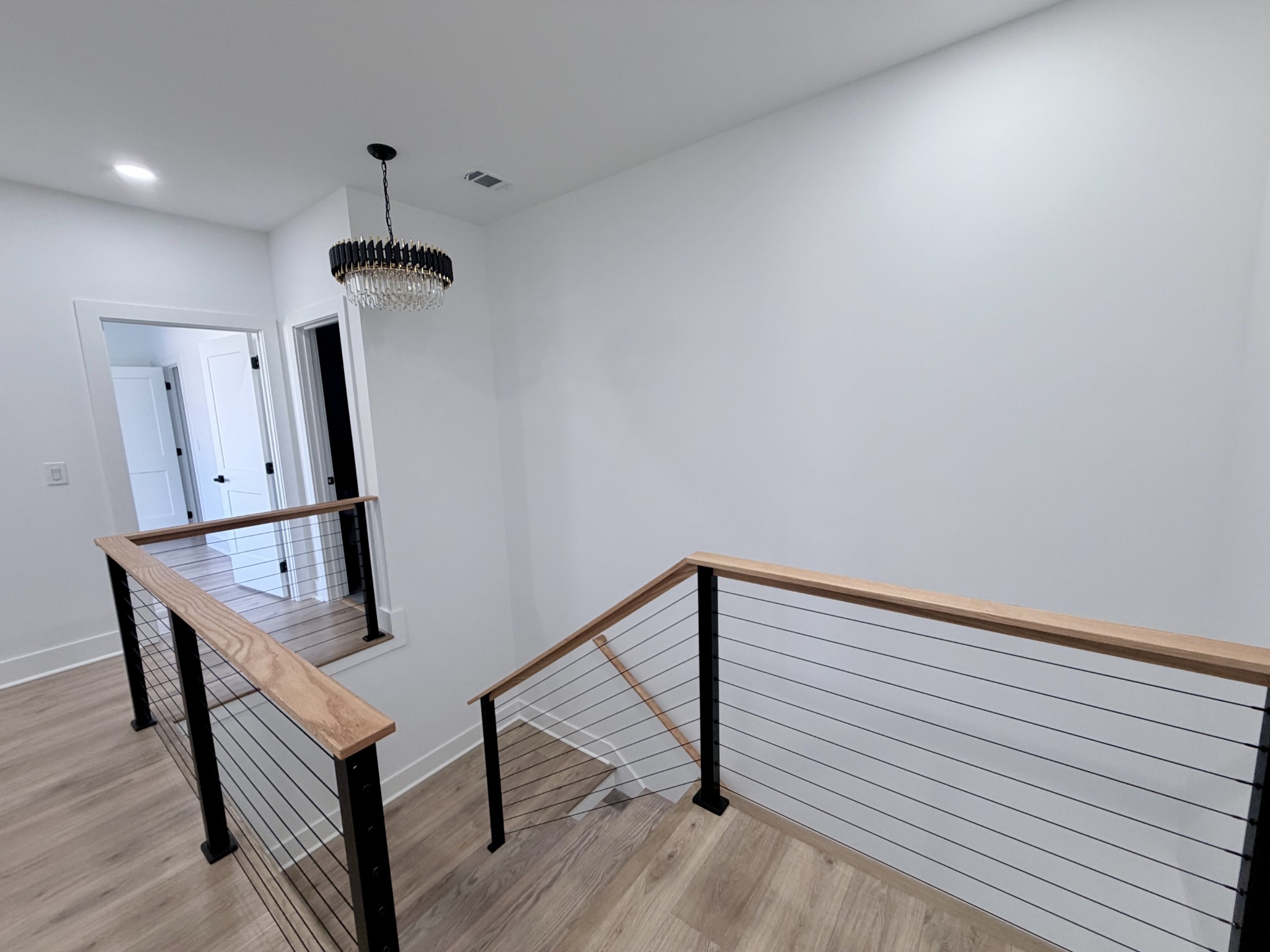 6447 Hopewell Road Springfield, TN 37172 - Photo 44 of 61 a view of hallway with stairs and wooden floor