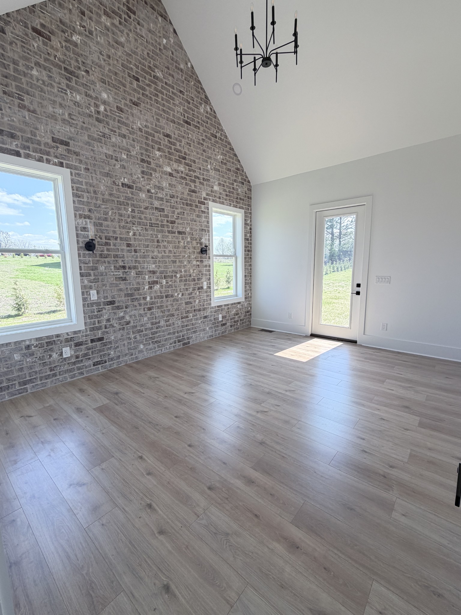 6447 Hopewell Road Springfield, TN 37172 - Photo 59 of 61 an empty room with wooden floor and windows