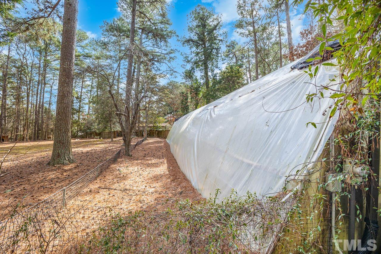 9006 Honeycutt Road Raleigh, NC 27615 - Photo 12 of 54 a view of a backyard