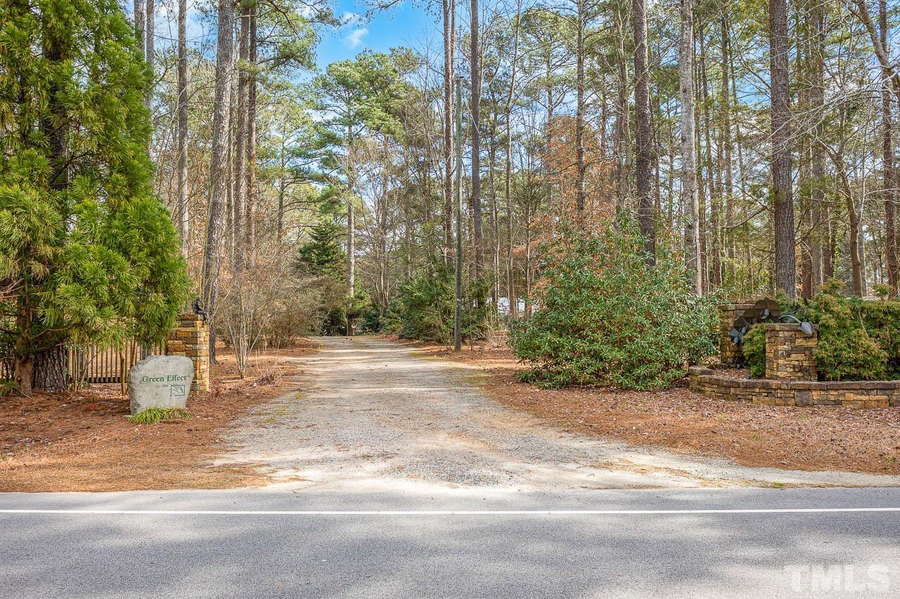 9006 Honeycutt Road Raleigh, NC 27615 - Photo 2 of 54 a view of a yard with a house