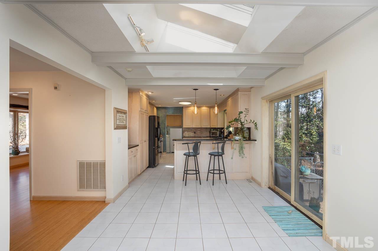 9006 Honeycutt Road Raleigh, NC 27615 - Photo 45 of 54 a view of a kitchen with furniture and a rug