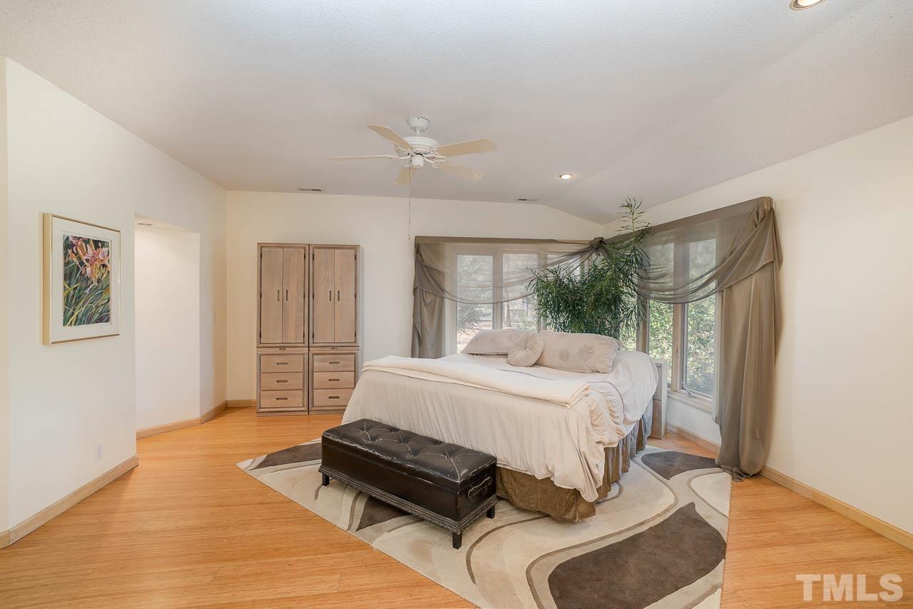 9006 Honeycutt Road Raleigh, NC 27615 - Photo 51 of 54 a bedroom with a bed couch and window