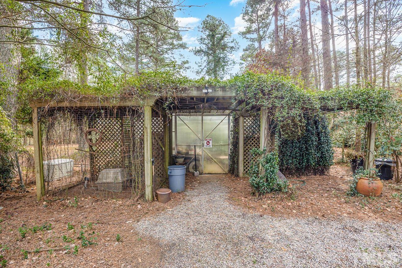 9006 Honeycutt Road Raleigh, NC 27615 - Photo 10 of 54 a view of a house with backyard and sitting area