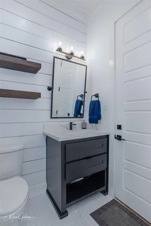 a kitchen with appliances a sink and a window
