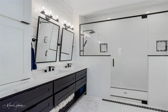 a bathroom with a double vanity sink mirror and double