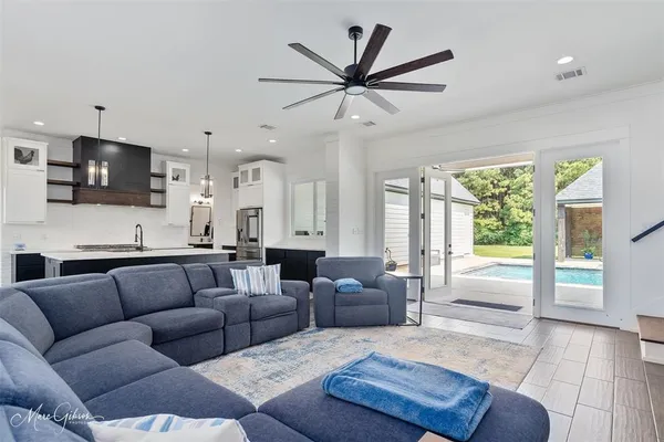 a living room with fireplace furniture and a flat screen tv