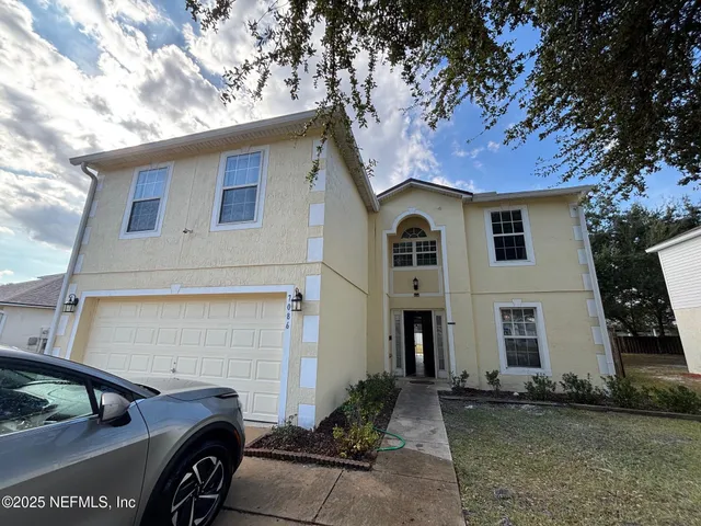 a stove top oven sitting inside of a kitchen