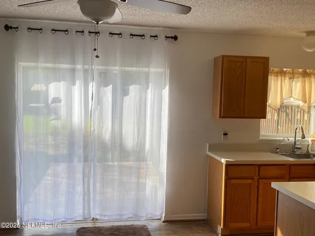 an empty room with wooden floor and a window