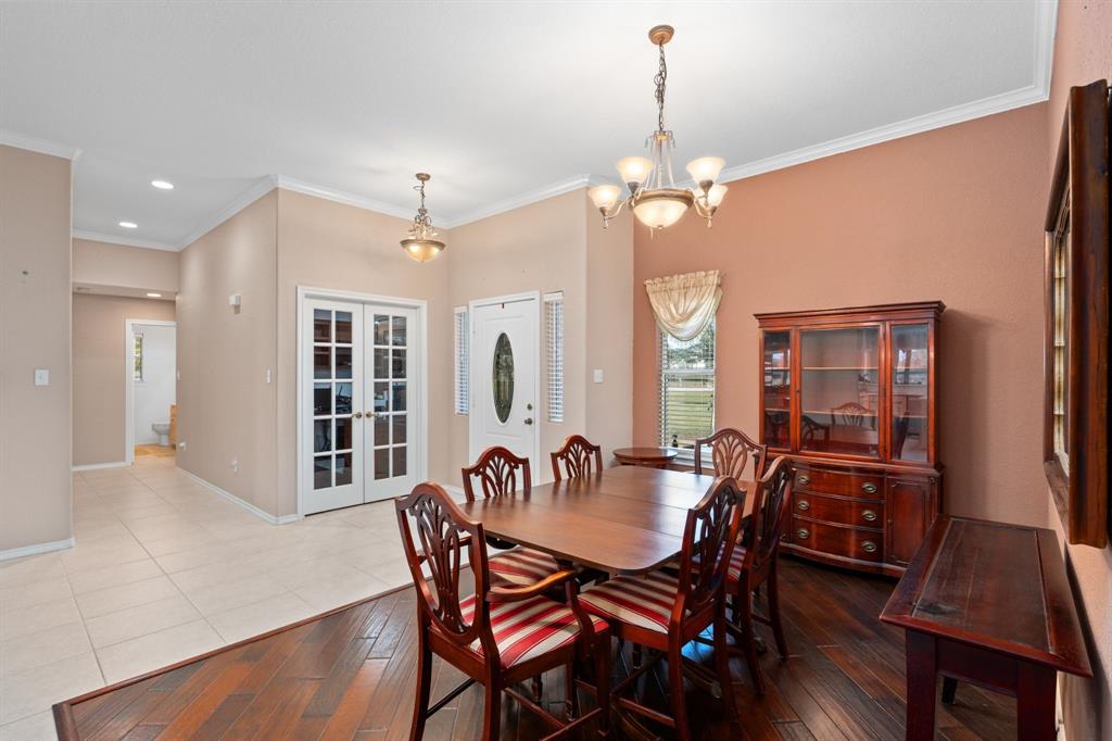 11306 Jennifer Circle Sanger, TX 76266 - Photo 4 of 24 a view of a dining room with furniture window and wooden floor