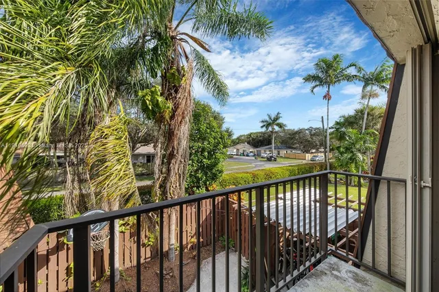 a view of balcony and yard
