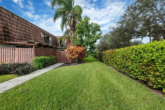 a backyard of a house with lots of green space