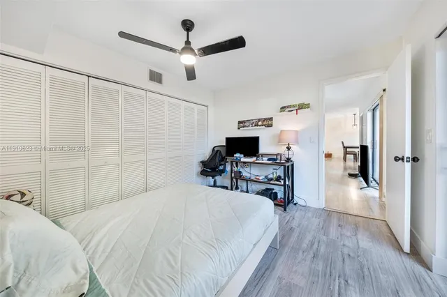 a bedroom with a bed and a desk