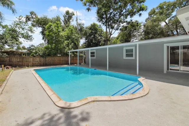 a view of a swimming pool with an outdoor space