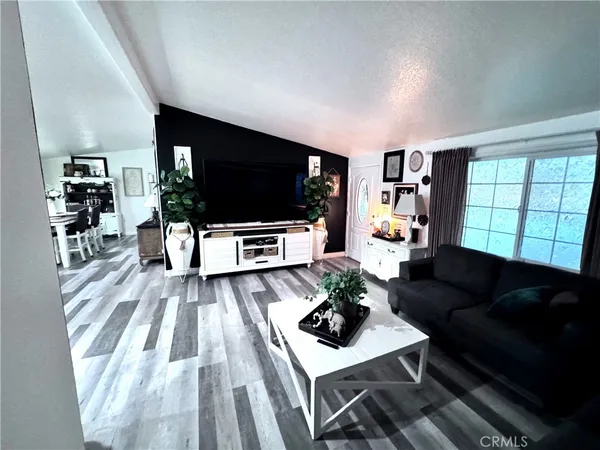 a kitchen with stainless steel appliances granite countertop a refrigerator stove and sink