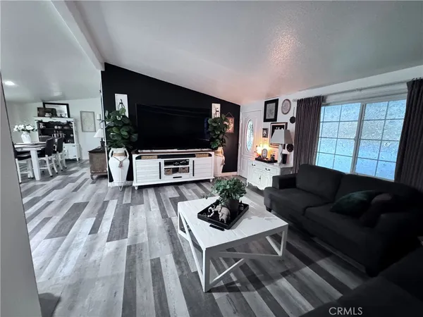 a kitchen with stainless steel appliances kitchen island granite countertop a sink stove and cabinets