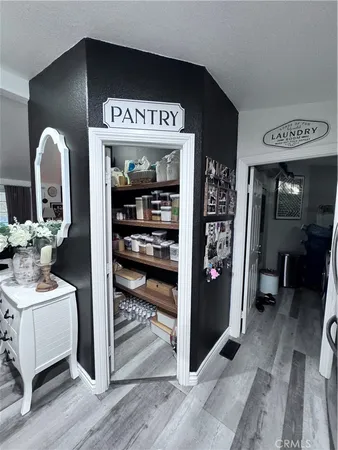 a kitchen with sink refrigerator and cabinets