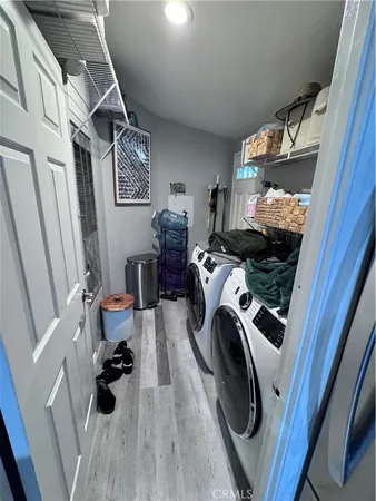 a bedroom with double bed and a couch