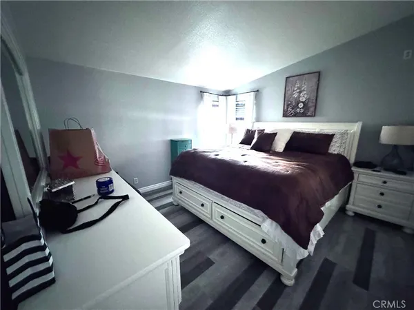 a bathroom with a toilet and a shower curtain