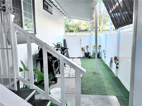 a view of a chairs and table in the patio