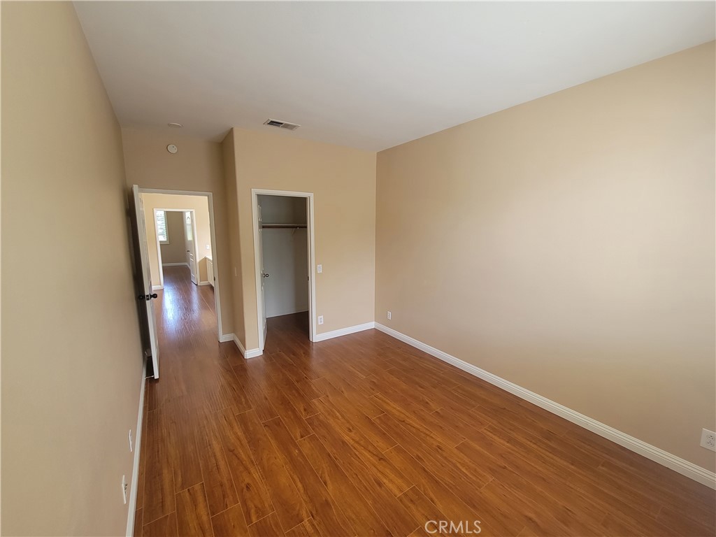 28 First Street Ladera Ranch, CA 92694 - Photo 15 of 18 a view of a hallway with wooden floor