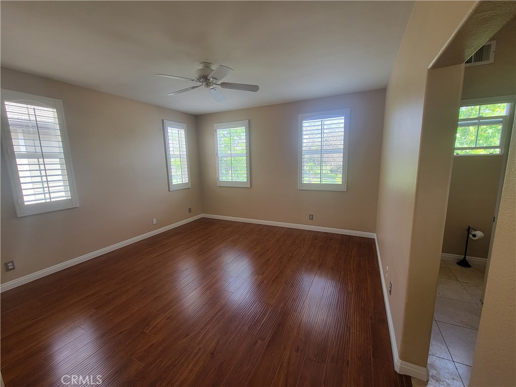 28 First Street Ladera Ranch, CA 92694 - Photo 16 of 18 an empty room with wooden floor and windows