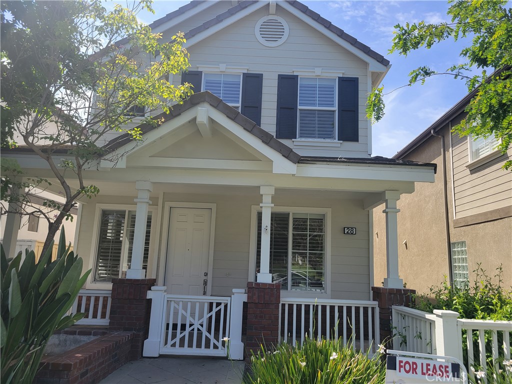 28 First Street Ladera Ranch, CA 92694 - Photo 2 of 18 a front view of a house with a porch