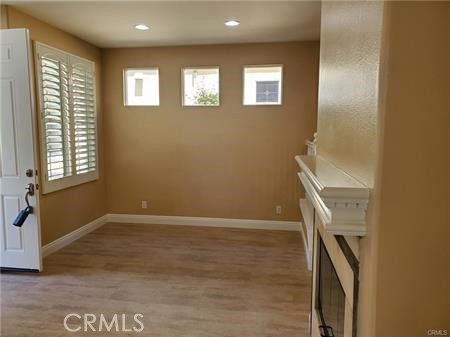 28 First Street Ladera Ranch, CA 92694 - Photo 7 of 18 wooden floor in an empty room with a window