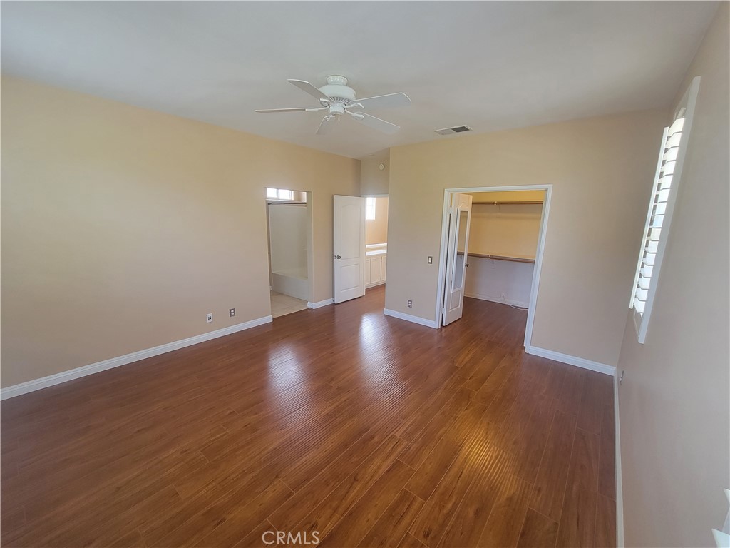 28 First Street Ladera Ranch, CA 92694 - Photo 9 of 18 a view of an empty room with wooden floor and a window