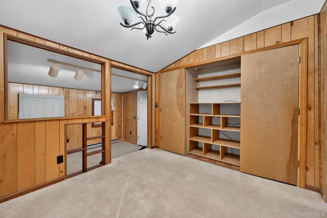 a view of room with window and closet