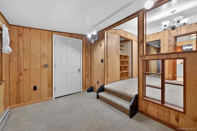 a spacious bedroom with a bed and a window