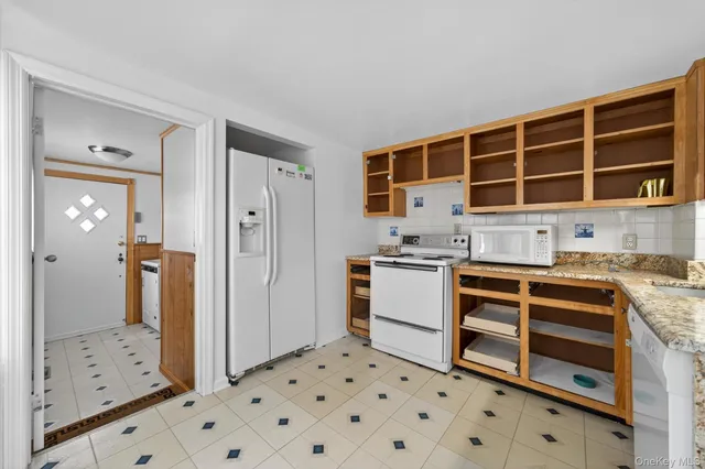 a kitchen with a stove and a refrigerator